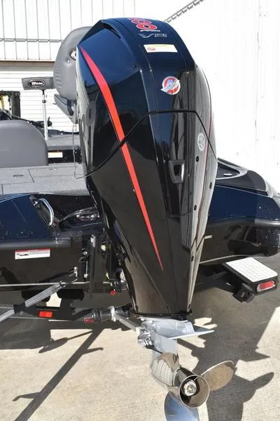 Slide: The Image of 2024 Triton 18 TrX boat with powerful outboard motor. - 8
