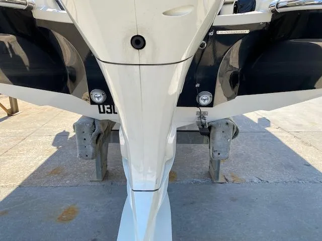 Slide: The Image of 2020 Stingray 201 DS boat stern view on a trailer. - 11