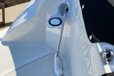 Slide: The Image of 2020 Stingray 201 DS boat with a built-in shower hose. - 22