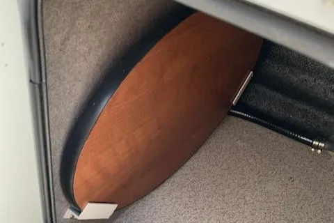 Slide: The Image of Wooden table stored in a 2020 Stingray 201 DS boat compartment. - 24