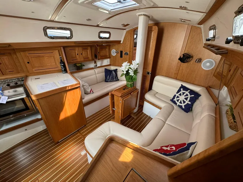 Slide: The Image of Luxurious interior of 2025 Tartan 365 yacht with elegant wood finish and plush seating. - 14