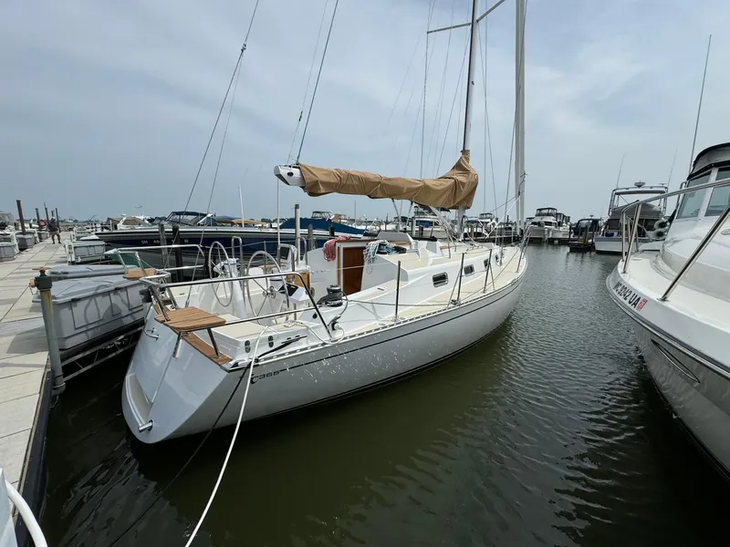 Slide: The Image of 2025 Tartan 365 sailboat docked in a marina, featuring sleek design and modern rigging. - 5