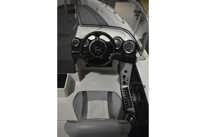 Slide: The Image of 2024 Triton 186 Allure boat cockpit with steering wheel and control panel. - 102