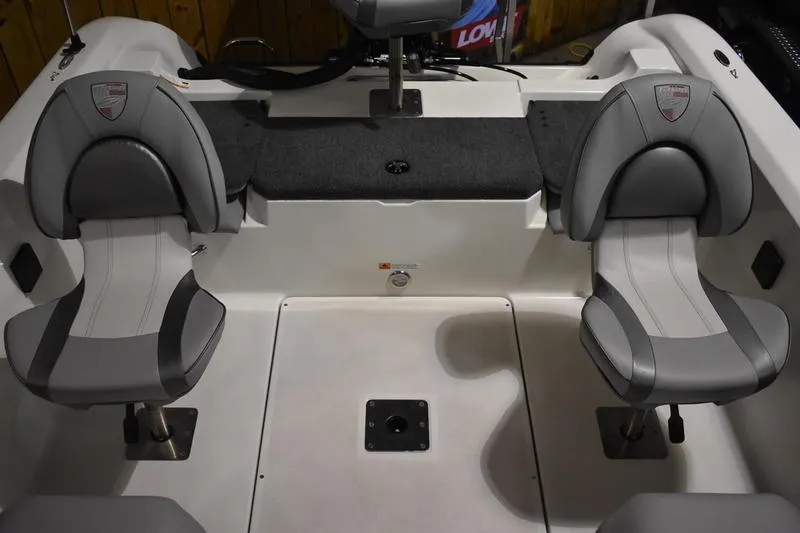 Slide: The Image of 2024 Triton 186 Allure boat interior with two gray cushioned seats. - 104