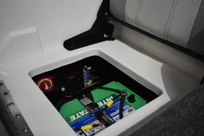 Slide: The Image of 2024 Triton 186 Allure boat battery compartment with Interstate battery and wiring. - 105