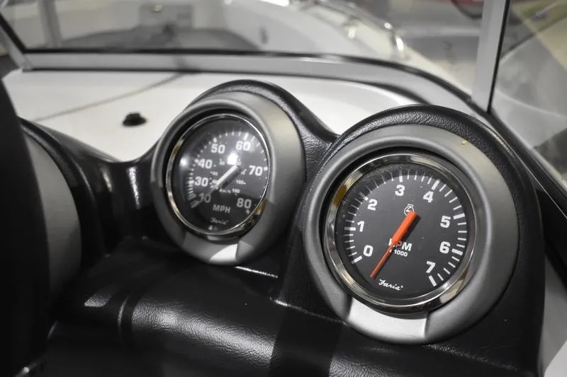 Slide: The Image of Dashboard gauges of a 2024 Triton 186 Allure boat, displaying speed and RPM. - 115