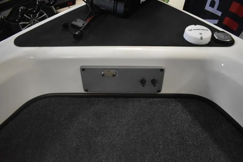 Slide: The Image of Black control panel for 2024 Triton 186 Allure boat, featuring various buttons and a display. - 13