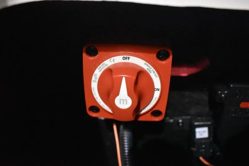 Slide: The Image of Red battery switch in 2024 Triton 186 Allure boat, labeled "OFF" and "ON." - 131
