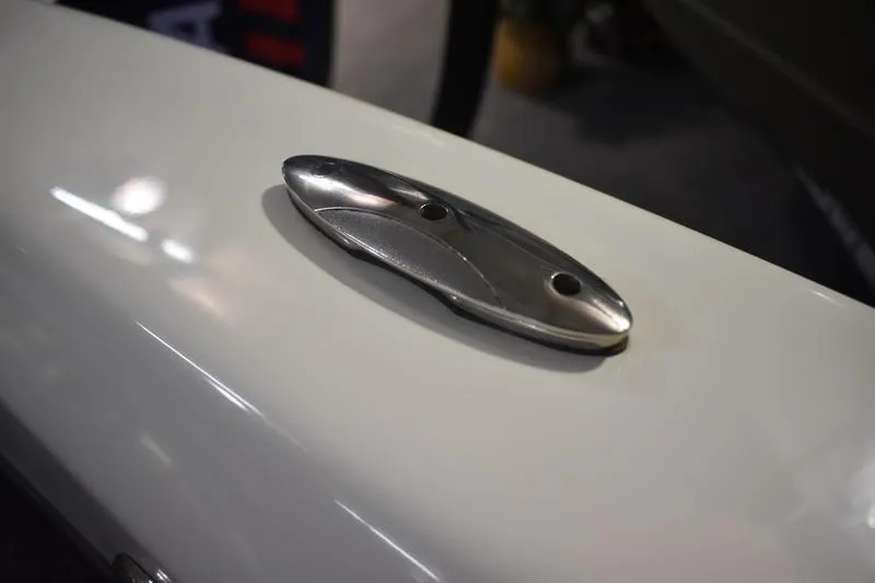 Slide: The Image of Close-up of a 2024 Triton 186 Allure boat cleat on a sleek white surface. - 136