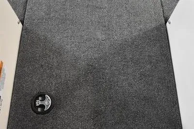 Slide: The Image of 2024 Triton 186 Allure boat interior with carpeted deck and storage compartment. - 22