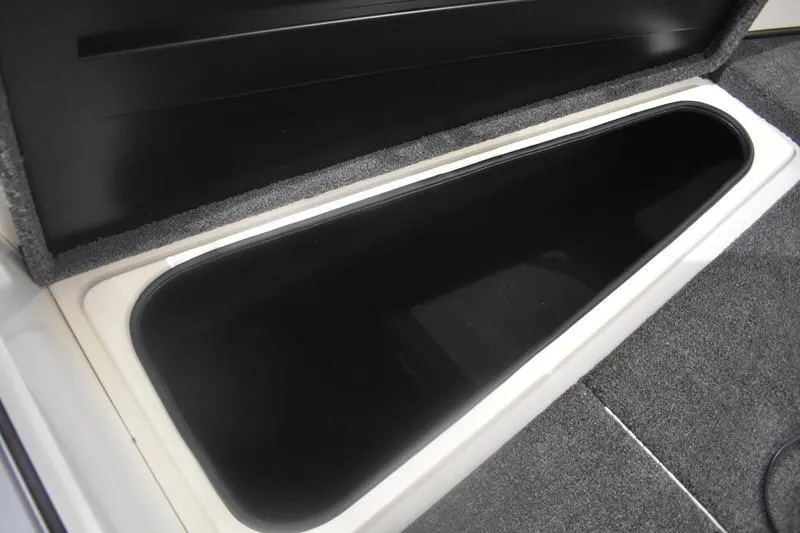 Slide: The Image of 2024 Triton 186 Allure boat interior detail with seating and storage compartments. - 47