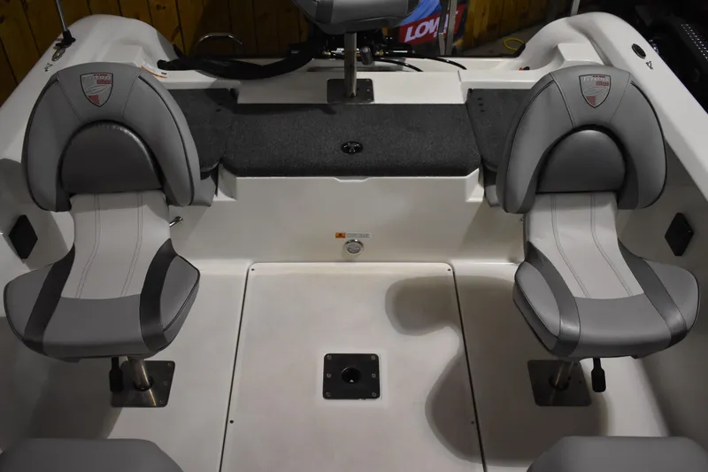 Slide: The Image of 2024 Triton 186 Allure boat interior with two gray seats and carpeted platform. - 53