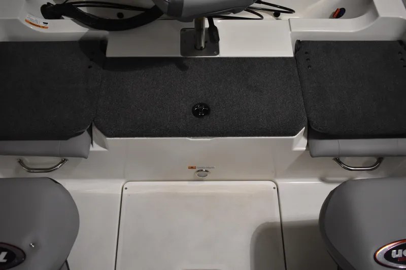 Slide: The Image of 2024 Triton 186 Allure boat interior with gray seating and carpeted flooring. - 57
