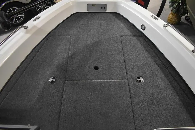 Slide: The Image of 2024 Triton 186 Allure boat deck with gray carpet and seating mounts. - 6