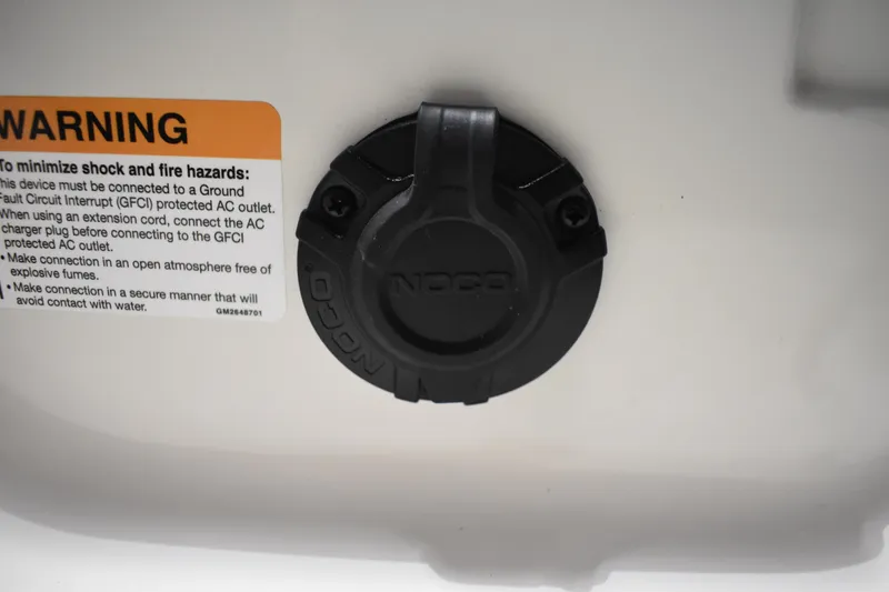 Slide: The Image of 2024 Triton 186 Allure warning label and NOCO charging port. - 75