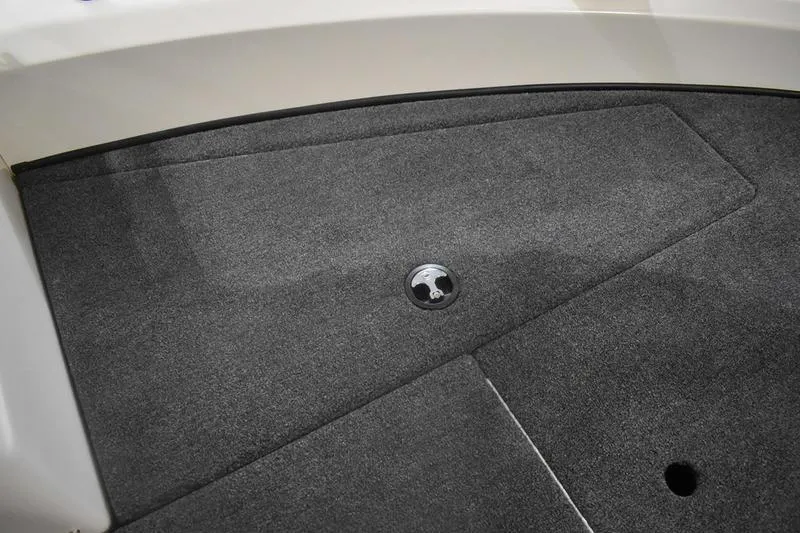 Slide: The Image of 2024 Triton 186 Allure boat deck with gray carpet and storage hatch. - 79