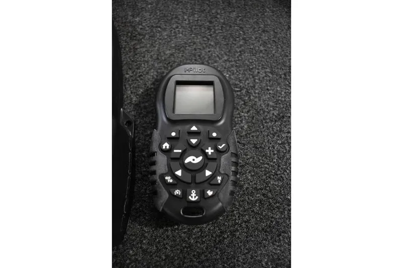 Slide: The Image of Remote control device on carpet for 2024 Triton 186 Allure boat. - 83