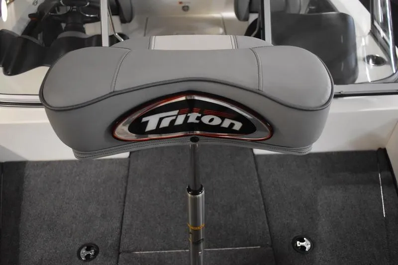 Slide: The Image of 2024 Triton 186 Allure boat seat with logo, featuring sleek gray upholstery. - 94