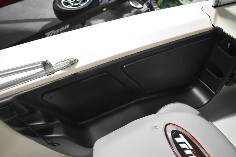 Slide: The Image of 2024 Triton 186 Allure boat interior with seating and storage compartments. - 97