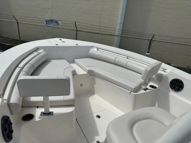 Slide: The Image of 2022 Sea Born 22 LX boat interior with white cushioned seating. - 10