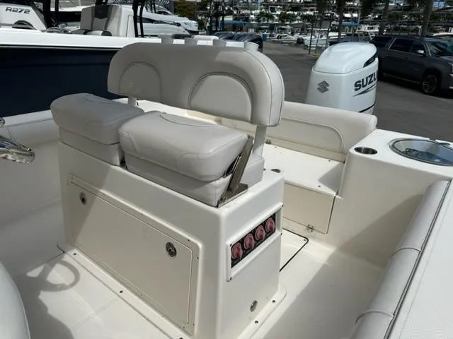 Slide: The Image of 2022 Sea Born 22 LX boat interior with white seating and storage compartments. - 11