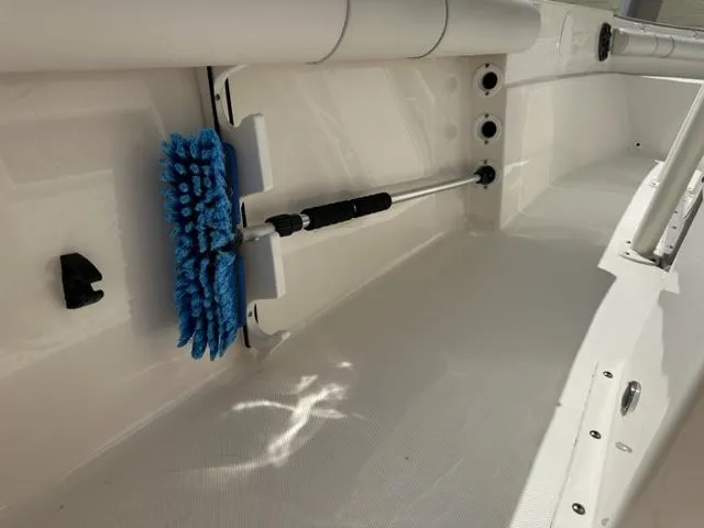Slide: The Image of 2022 Sea Born 22 LX boat interior with mounted cleaning brush. - 12