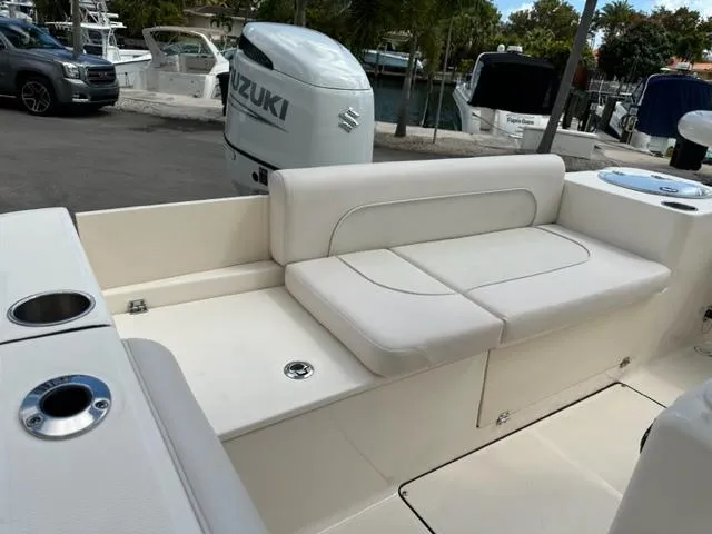 Slide: The Image of 2022 Sea Born 22 LX boat with Suzuki outboard motor and cushioned seating. - 4