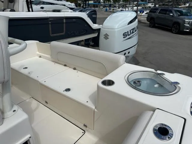 Slide: The Image of 2022 Sea Born 22 LX boat interior with Suzuki outboard motor in marina. - 9