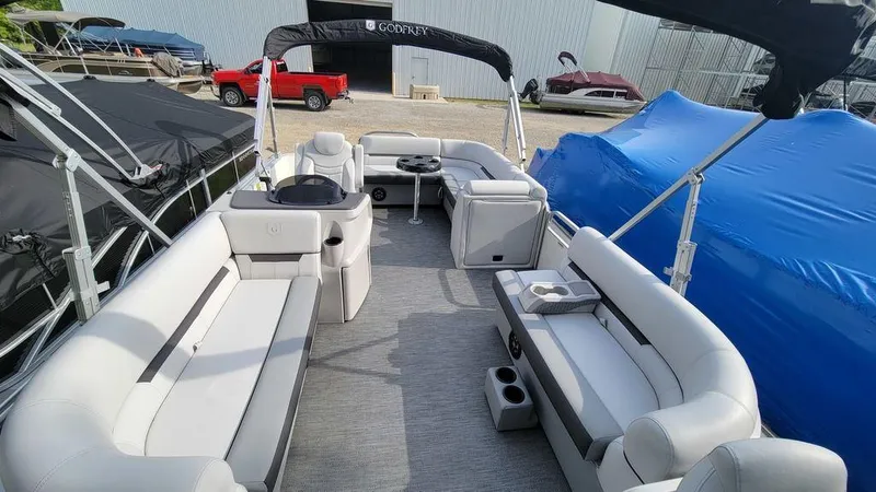 Slide: The Image of 2023 Godfrey Sweetwater 2086 BF GTP pontoon boat interior with spacious seating and modern amenities. - 10