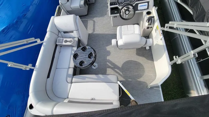 Slide: The Image of 2023 Godfrey Sweetwater 2086 BF GTP 27 in. Center Tube boat interior with seating and steering console. - 4