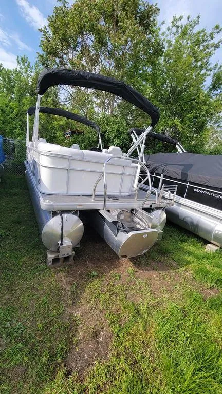 Slide: The Image of 2023 Godfrey Sweetwater 2086 BF GTP 27 in. Center Tube pontoon boat on grass. - 5