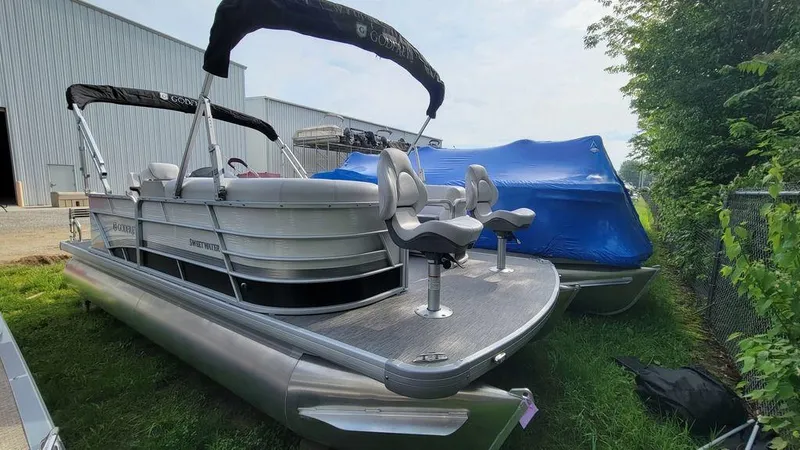 Slide: The Image of 2023 Godfrey Sweetwater 2086 BF GTP pontoon boat with 27-inch center tube, docked outdoors. - 6