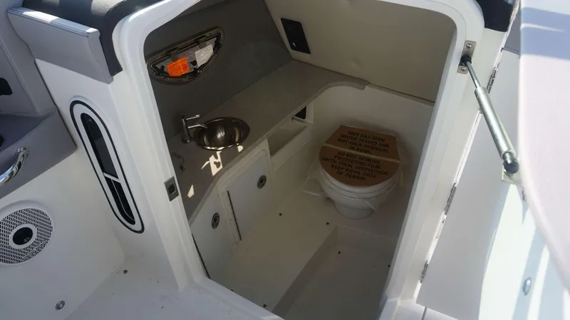 Slide: The Image of 2024 Cobalt 30 SC boat interior with sink and toilet. - 17