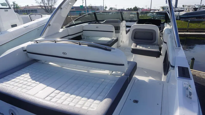 Slide: The Image of 2024 Cobalt 30 SC boat interior with luxurious white seating and modern design. - 4