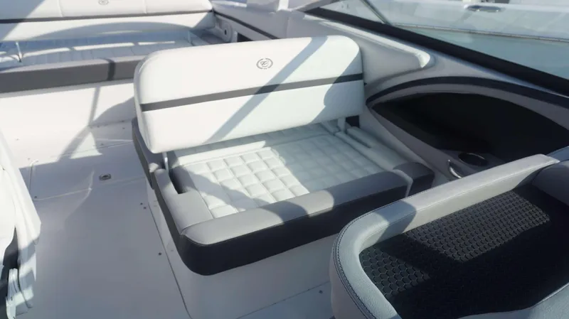 Slide: The Image of 2024 Cobalt 30 SC boat interior with white and gray seating. - 9