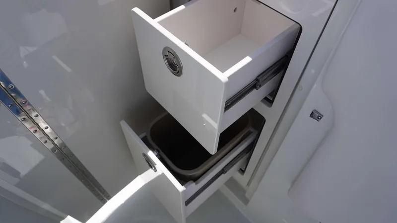 Slide: The Image of Storage drawers on the 2024 Crownline 280 DC boat. - 17