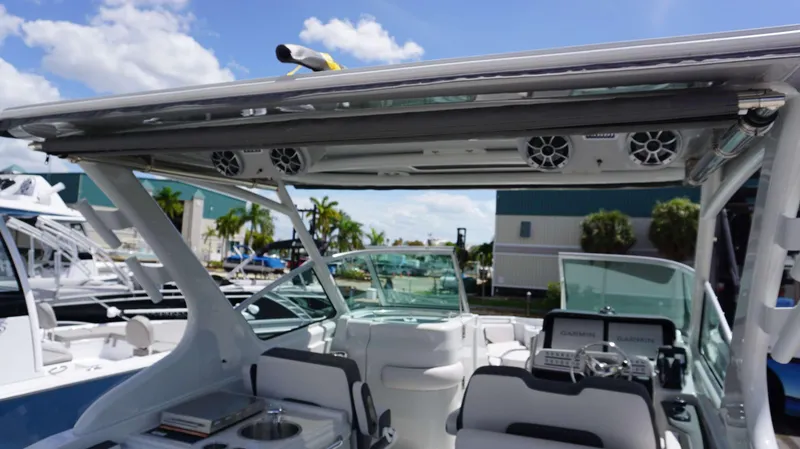 Slide: The Image of 2024 Crownline 280 DC boat interior with advanced navigation system and seating. - 21