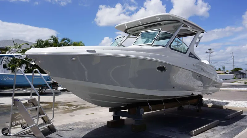 Slide: The Image of 2024 Crownline 280 DC boat on a stand, ready for launch. - 23