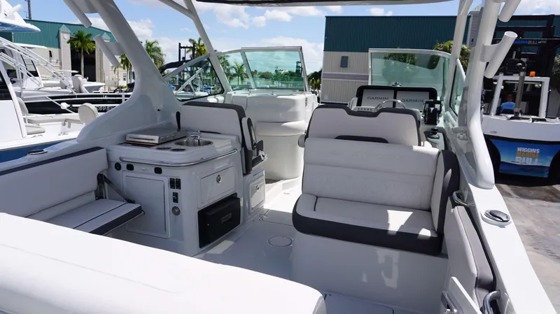 Slide: The Image of 2024 Crownline 280 DC boat interior with seating and control panel. - 24