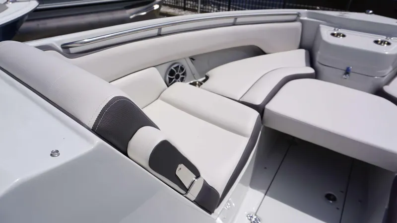 Slide: The Image of 2024 Crownline 280 DC boat interior with white and gray seating. - 27