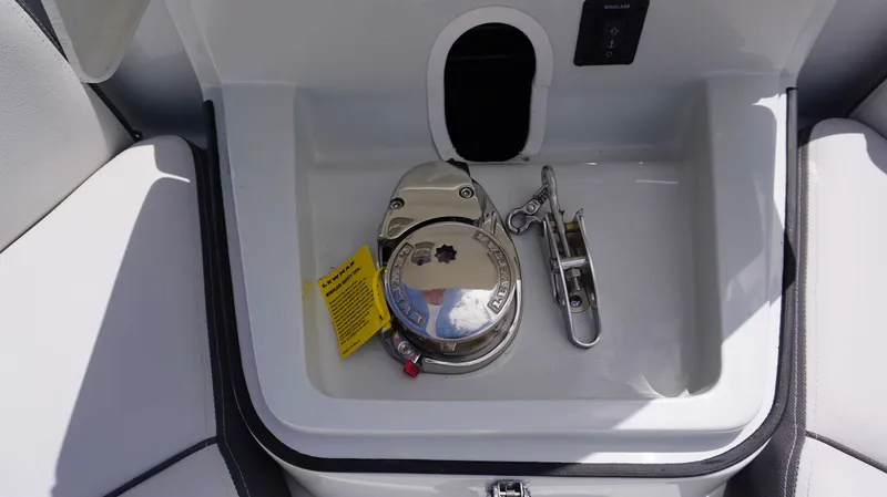 Slide: The Image of Anchor windlass compartment on 2024 Crownline 280 DC boat. - 30