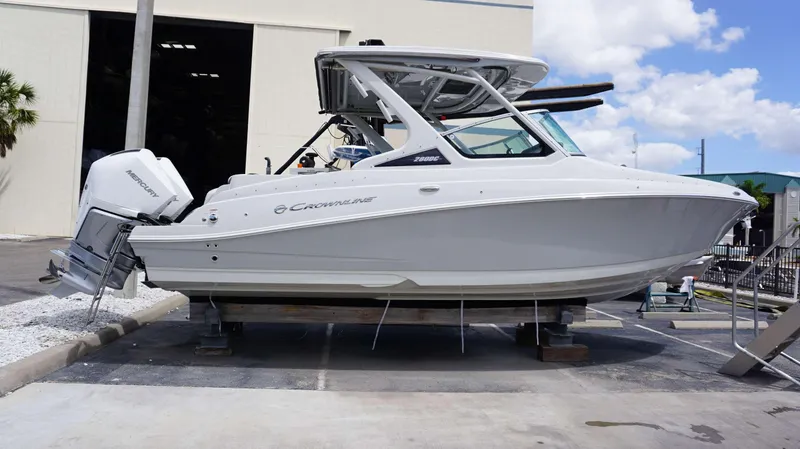 Slide: The Image of 2024 Crownline 280 DC boat with Mercury outboard engine on display. - 31