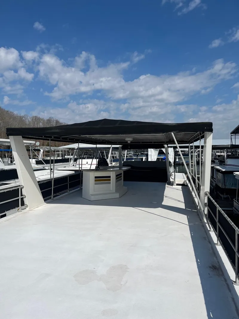 Slide: The Image of 2003 Lakeview Houseboat with spacious upper deck and canopy. - 27