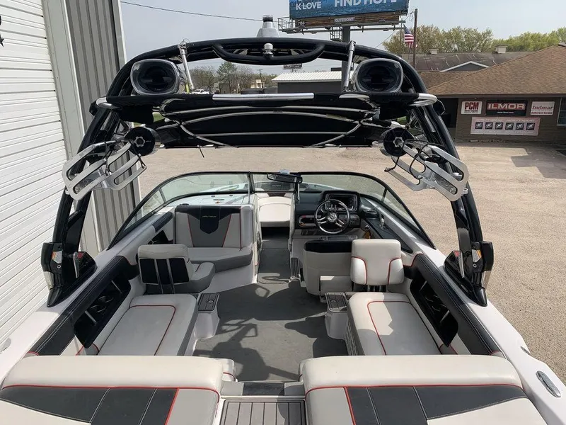 Slide: The Image of 2012 Nautique 230 boat interior with seating and wakeboard tower. - 6