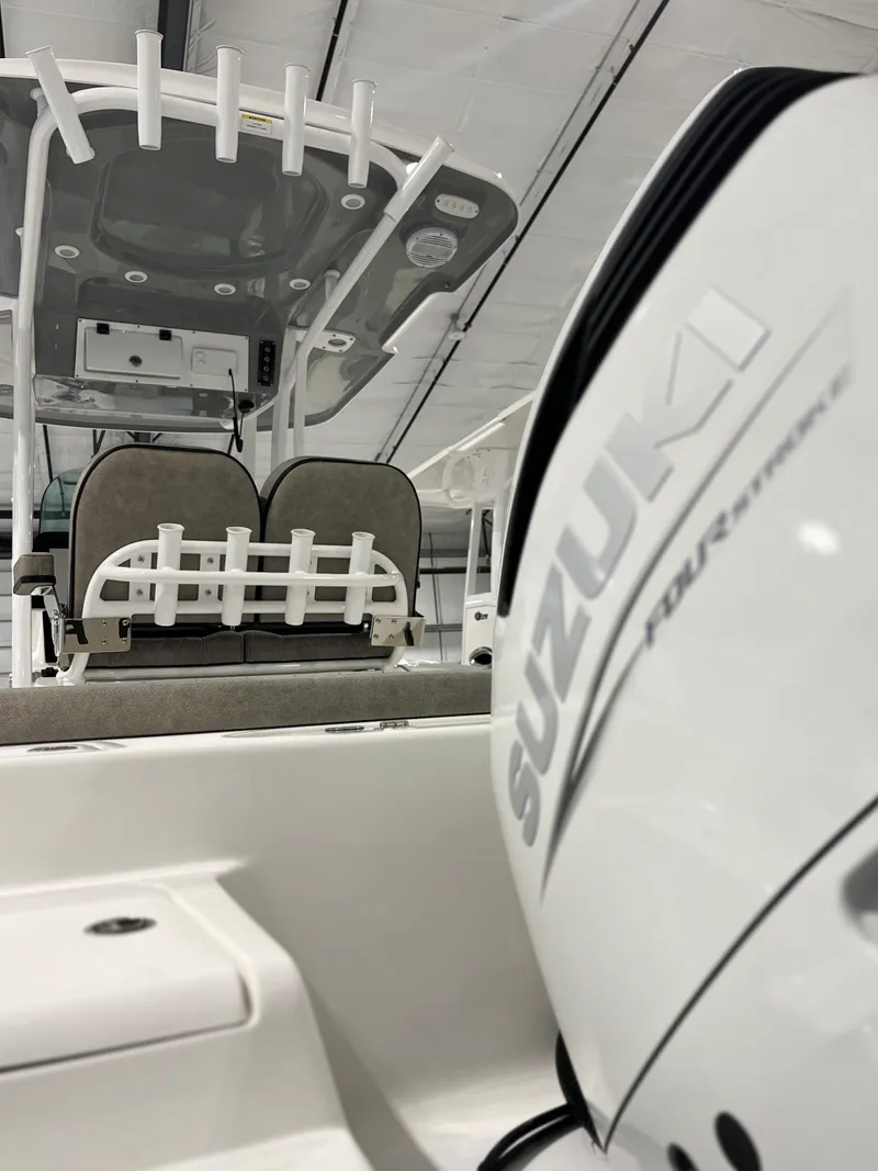 Slide: The Image of 2024 Sea Pro 242 DLX boat with Suzuki outboard motor. - 17