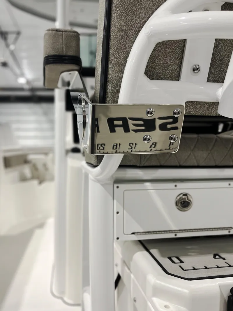 Slide: The Image of 2024 Sea Pro 242 DLX boat interior detail with stainless steel components. - 5