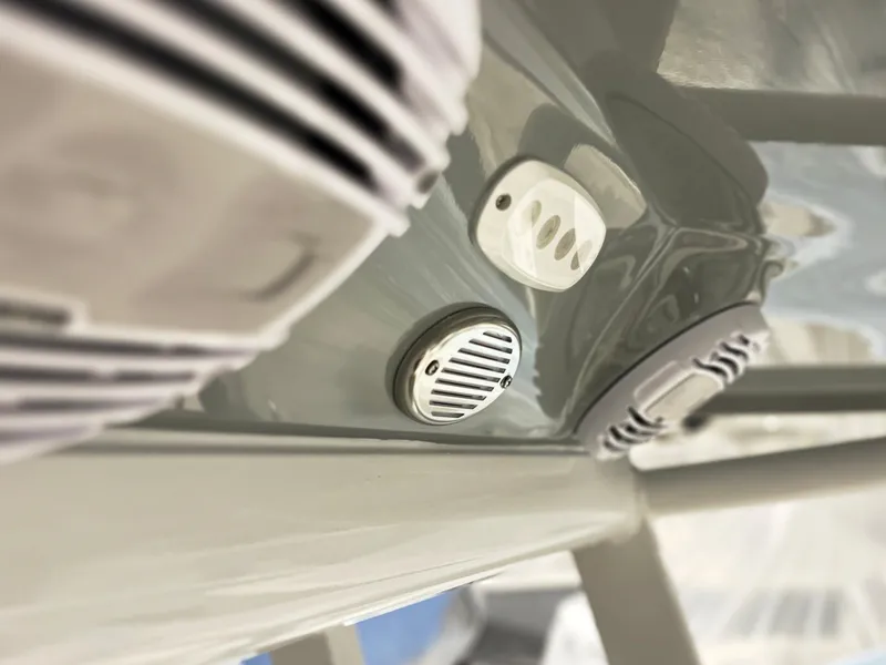 Slide: The Image of Close-up of 2024 Sea Pro 242 DLX boat's audio system and ventilation. - 8