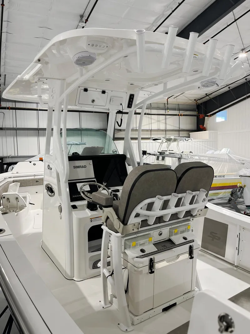 Slide: The Image of 2024 Sea Pro 242 DLX boat interior with dual seats and advanced navigation system. - 3