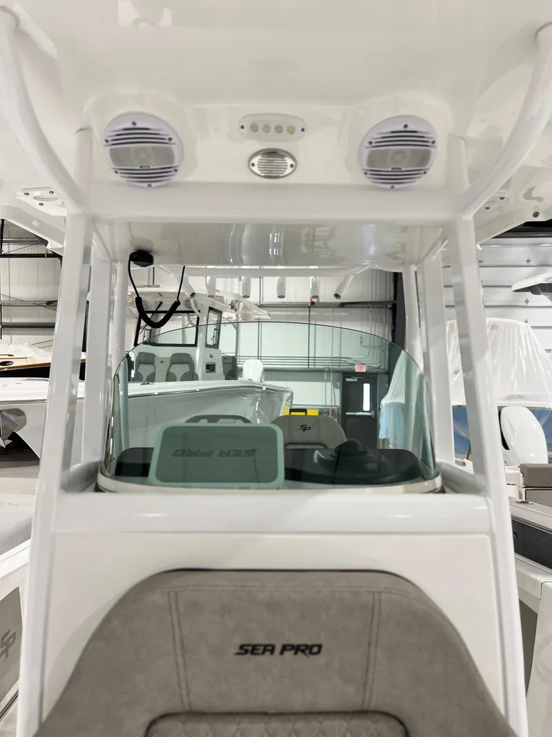 Slide: The Image of 2024 Sea Pro 242 DLX boat interior with helm station and electronics. - 5