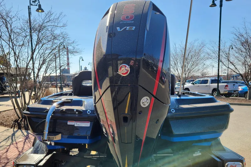 Slide: The Image of 2024 Nitro Z21 XL Pro boat with powerful V8 engine in a parking lot. - 1